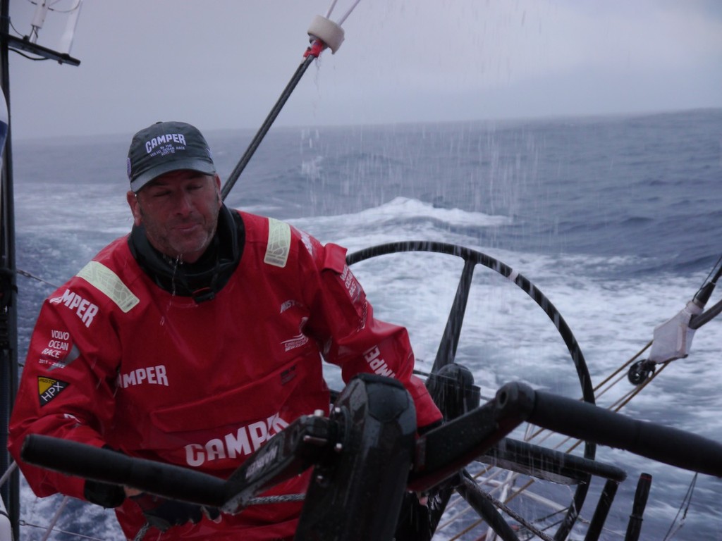 Rob Salthouse trimming in the rain onboard Camper with Emirates Team New Zealand during leg 1 of the Volvo Ocean Race 2011-12, from Alicante, Spain to Cape Town, South Africa.  © Hamish Hooper/Camper ETNZ/Volvo Ocean Race